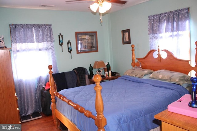 bedroom with hardwood / wood-style flooring and ceiling fan