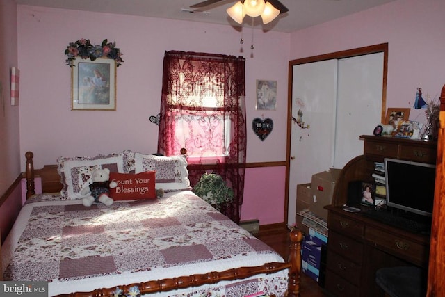 bedroom featuring ceiling fan and a closet