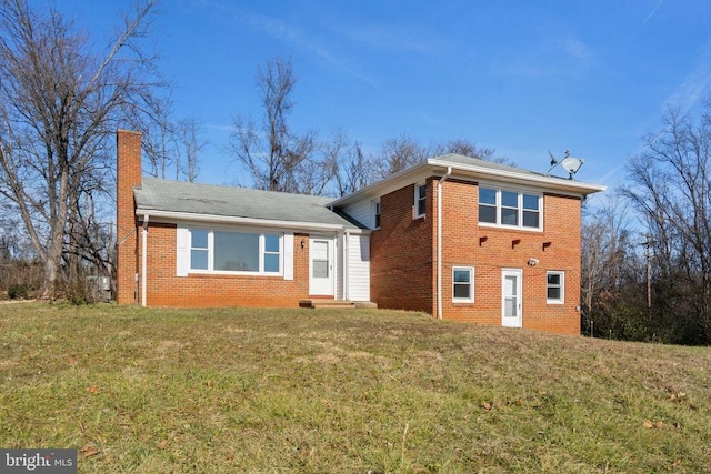 view of front facade featuring aphalt driveway, brick siding, and an attached garage