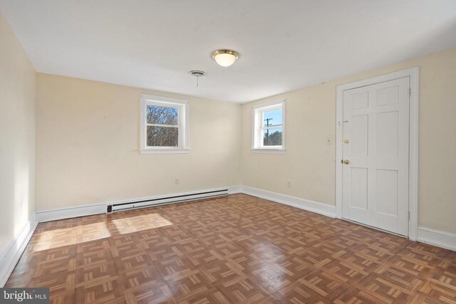 empty room featuring visible vents and baseboards