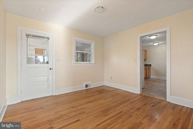 interior space with visible vents, a healthy amount of sunlight, baseboards, and light wood-style floors