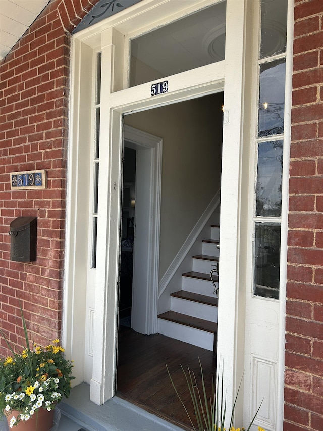 property entrance with brick siding