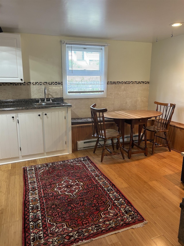 dining space featuring light wood finished floors