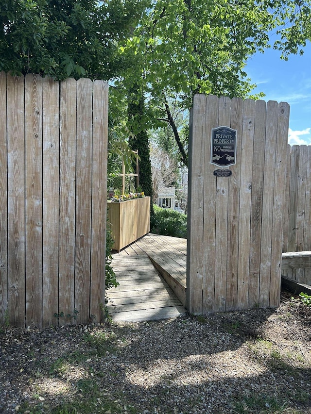 view of outbuilding featuring fence