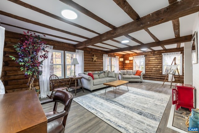 living room with beam ceiling, log walls, and dark wood-type flooring