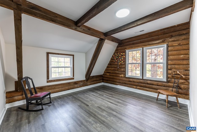 unfurnished room featuring lofted ceiling with beams, dark hardwood / wood-style flooring, and log walls