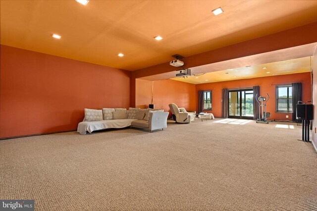 unfurnished living room featuring light colored carpet