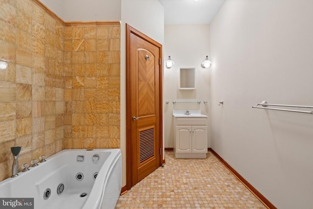 bathroom with vanity and a bath