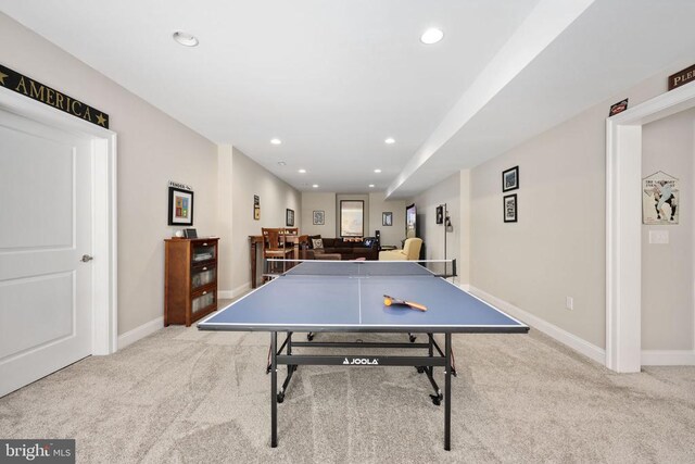 recreation room featuring light carpet