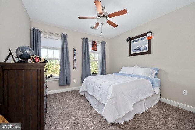 carpeted bedroom with ceiling fan