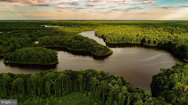 aerial view at dusk with a water view