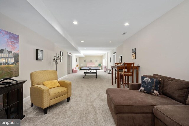 living room featuring light carpet