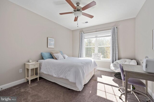 bedroom with dark carpet and ceiling fan