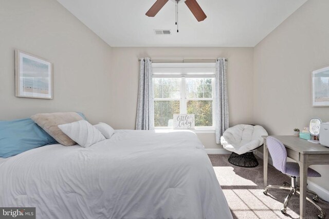 bedroom featuring ceiling fan and carpet