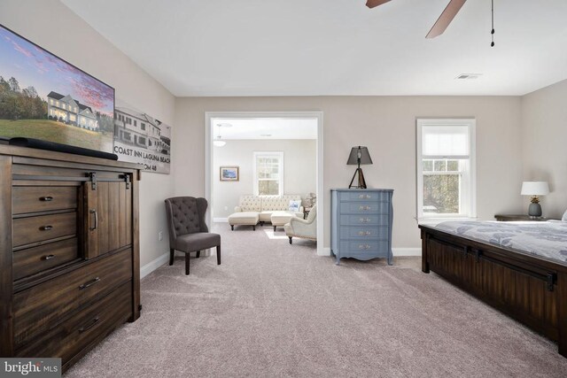 carpeted bedroom with ceiling fan