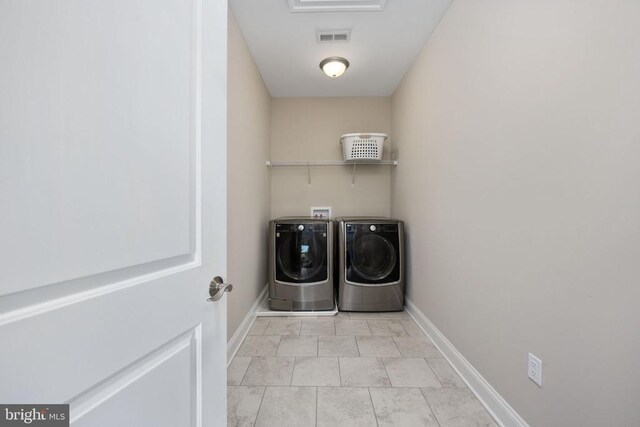 laundry area featuring washing machine and dryer