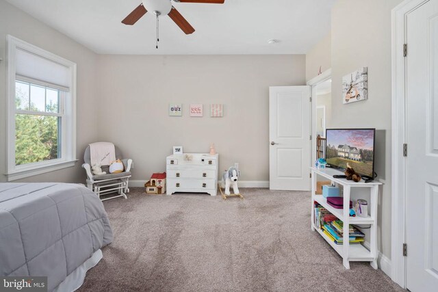 carpeted bedroom featuring ceiling fan