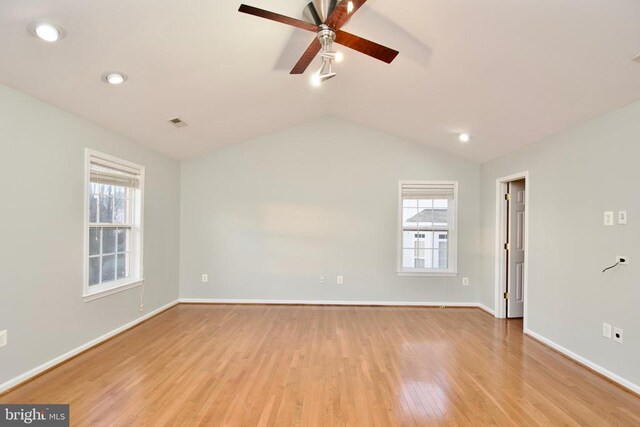 unfurnished room with ceiling fan, lofted ceiling, and light hardwood / wood-style floors