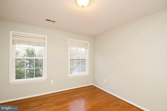 empty room featuring wood-type flooring