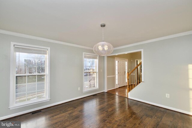 dining room with ornamental molding, a chandelier, and dark hardwood / wood-style flooring