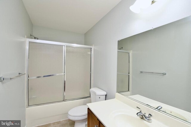 full bathroom with shower / bath combination with glass door, vanity, and toilet