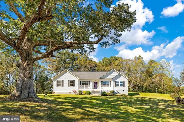 single story home with covered porch and a front lawn