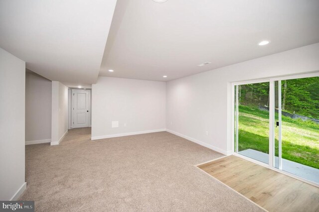 empty room featuring light carpet