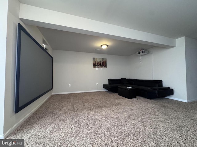 carpeted living area featuring baseboards