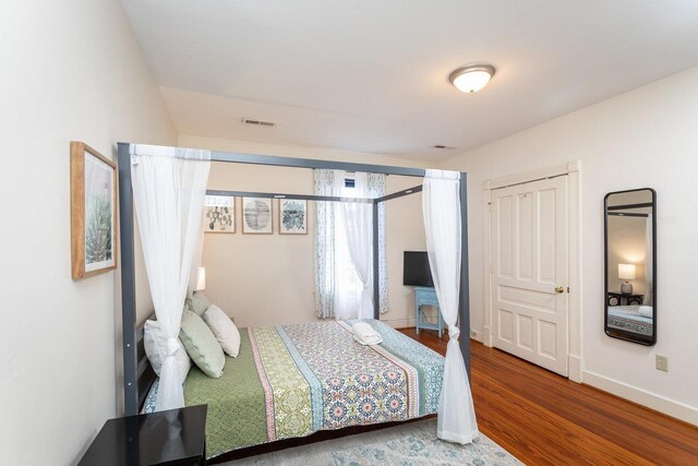 bedroom featuring hardwood / wood-style floors