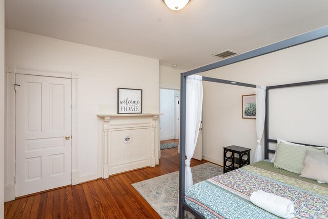 bedroom with hardwood / wood-style flooring