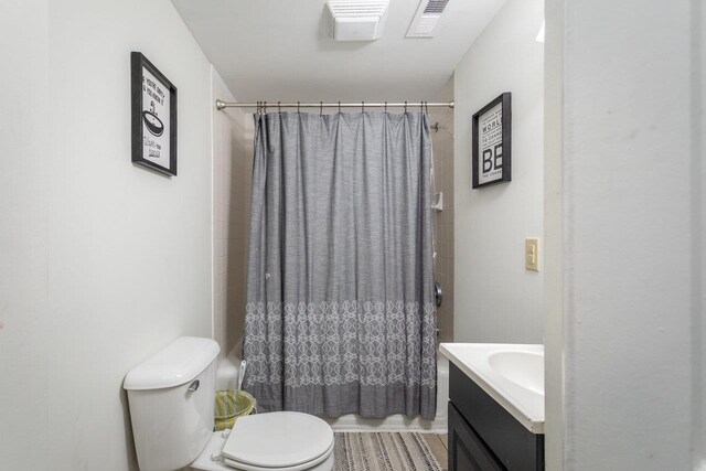 full bathroom with vanity, toilet, and shower / bath combo with shower curtain