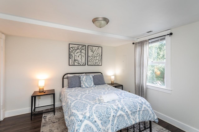 bedroom featuring dark hardwood / wood-style flooring