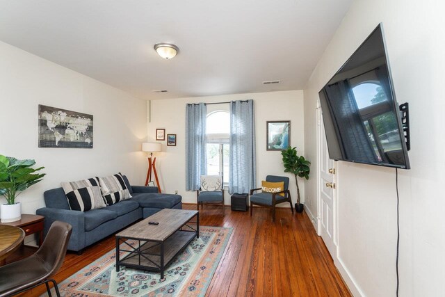 living room featuring dark hardwood / wood-style flooring