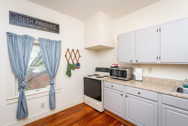 kitchen featuring dark wood-type flooring, white cabinetry, white electric range, and sink
