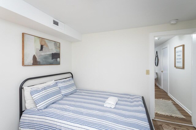 bedroom with wood-type flooring
