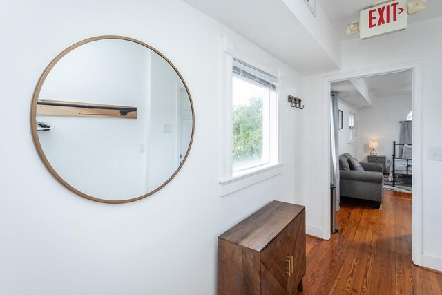 hallway with dark wood-type flooring