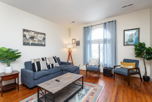 living room featuring dark hardwood / wood-style floors