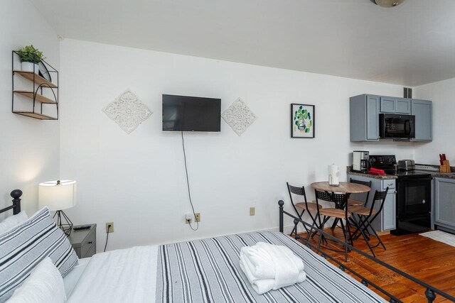 bedroom featuring dark hardwood / wood-style flooring