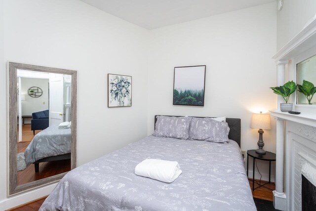 bedroom with hardwood / wood-style floors