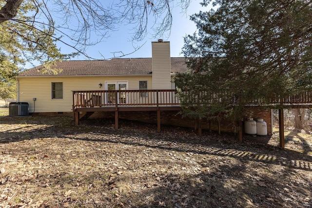 back of house with crawl space, a chimney, a wooden deck, and central AC