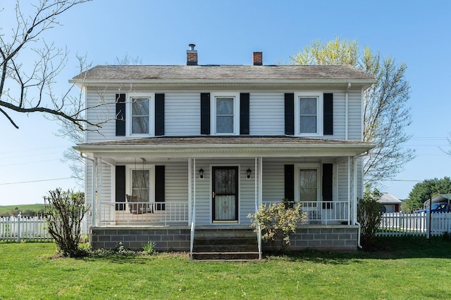 view of front of property with a porch and a front lawn