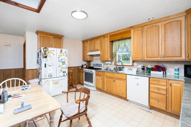 kitchen with white appliances and sink