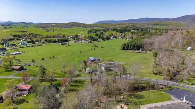 birds eye view of property with a mountain view