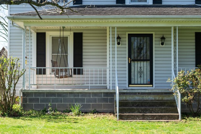 doorway to property with a porch