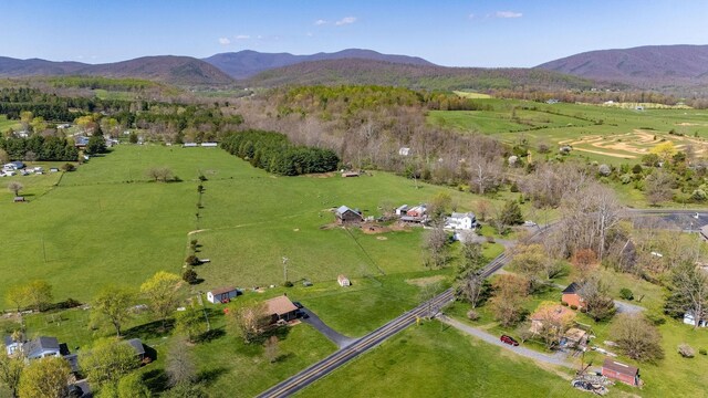 bird's eye view with a mountain view and a rural view