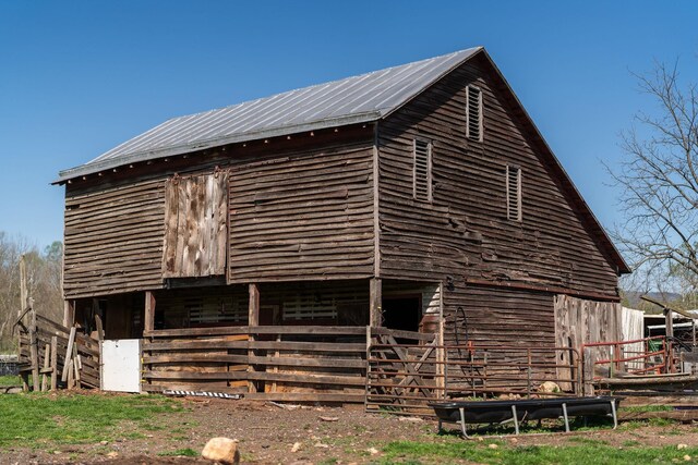 view of home's exterior featuring an outbuilding