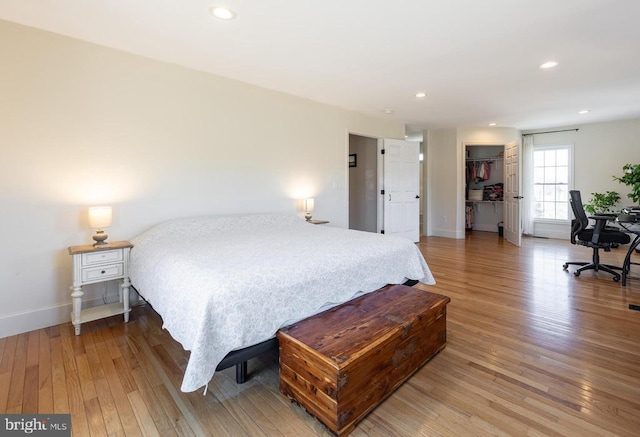 bedroom featuring recessed lighting, baseboards, and wood finished floors