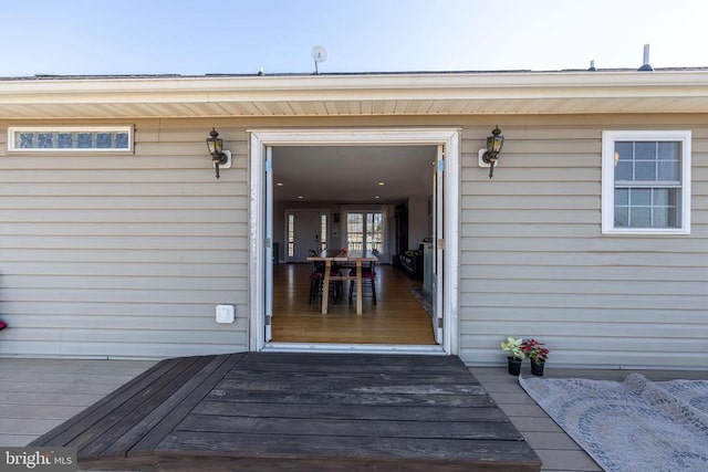 property entrance featuring a wooden deck