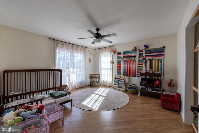 bedroom featuring ceiling fan and wood finished floors