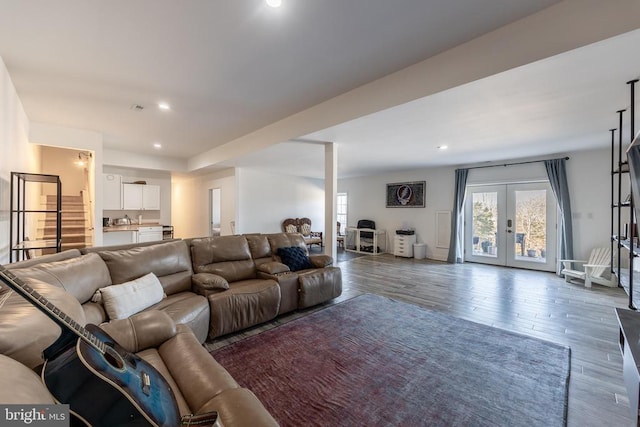 living room with french doors, dark wood-type flooring, and recessed lighting